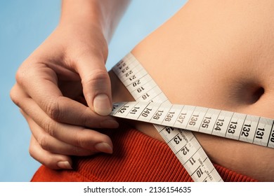 Woman Measures Hip Circumference With Tape Measure