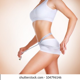 Woman Measuring Her Waistline. Diet. Perfect Slim Body