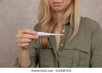 Woman Measuring Temperature. Basal Body Temperature And Fertility Concept