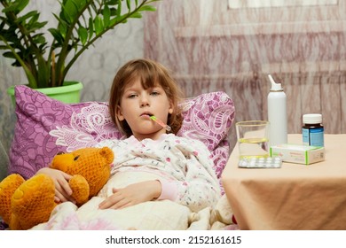 Woman Measuring Temperature Of Little Sick Girl