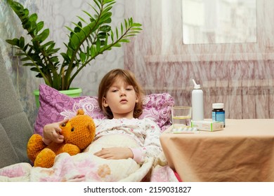 Woman Measuring Temperature Of Little Sick Girl