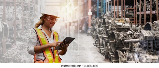 Woman Mechanic Worker Working At Old Motor Automotive Spare Parts Warehouse. Woman Engineer Checking Old Engine, Motor, Machine At The Garage Industry Factory. Double Exposure