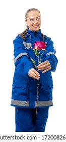 Woman In Medical Uniform And A Stethoscope. Doctor, Paramedic, Nurse Smiles, Looks At Us. An Ambulance Worker Holds A Rose And Holds Out A Flower To Us On Camera. White Background