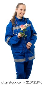 Woman In Medical Uniform And A Stethoscope. Doctor, Paramedic, Nurse Smiles, Looks At Us. An Ambulance Worker Holds A Rose And Points A Finger At The Flower. White Background