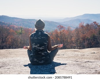 Woman Is Meditating At Stone Mountain State Park, NC.