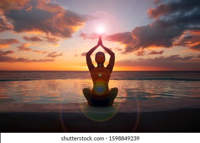 A woman is meditating at sunset. Healthy lifestyle concept. 