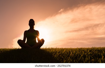 Woman Meditating In A Yoga Pose