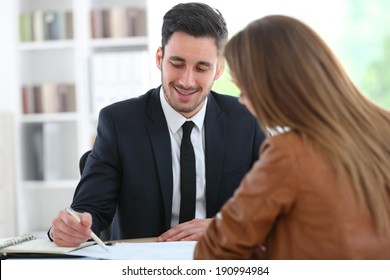 Woman Meeting Financial Adviser In Office