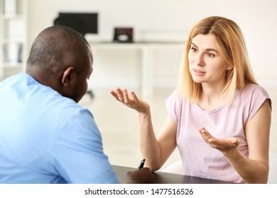 Woman meeting with plastic surgeon before operation in clinic - Shutterstock ID 1477516526