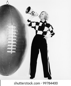 Woman with megaphone and huge football