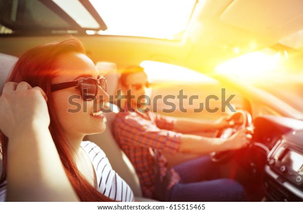 Woman and men in car and
summer trip 