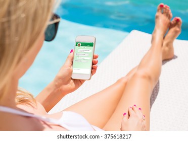 Woman messaging with friend on her smartphone - Powered by Shutterstock