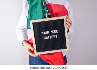 Woman With Mexico  Flag Holding Letter Board With Text Your Vote Matters On White Background