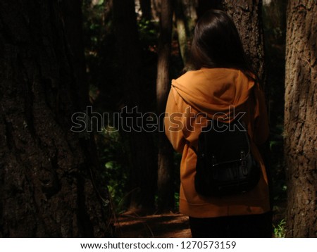 
Woman in the middle of the forest