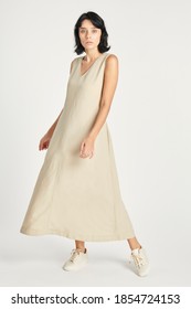 Woman In A Minimal Beige Dress Mockup