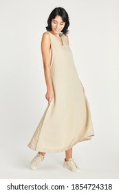 Woman In A Minimal Beige Dress Mockup