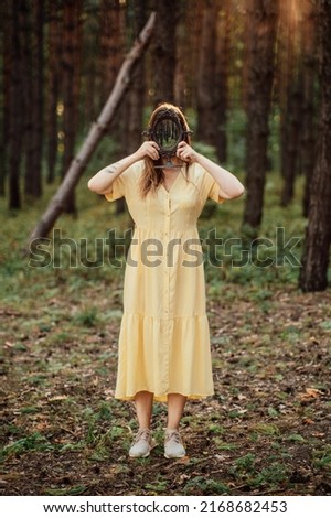 Woman with mirror instead of face on the forest background. Mindfulness, Mind and soul, Mental health, wellbeing