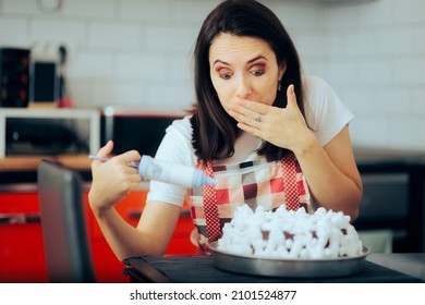 
Woman Misspelling On A Cake Making A Funny Oops Face. Cook Using A Decorating Syringe Making Mistakes On Cake Design Writing 
