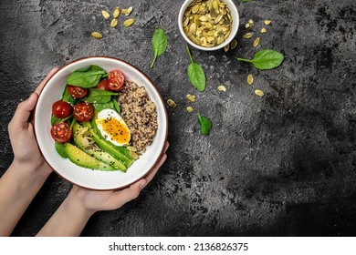 Woman Mixing Delicious Superfood Salad Quinoa, Avocado, Egg, Tomatoes, Spinach And Sunflower Seeds On Dark Background. Healthy Food, Ketogenic Diet, Diet Lunch Concept, Place For Text, Top View,