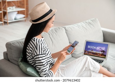 Woman With Mobile Phone Booking Room In Hotel Online At Home