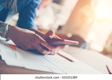 Woman With Mobile Phone. Paperwork On The Table, Loft Office. Film Effect And Sun Glare Effect