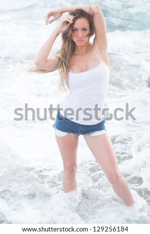 Young, long-legged, slim woman on the beach