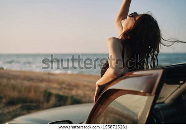 woman model on\
vacation in the car on\
vacation