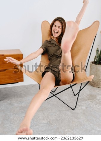 Similar – Woman in an armchair