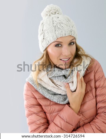 Woman model with winter outfit, isolated