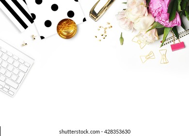 Woman modern background. Flat lay. Flower on the table. Keyboard and stapler. Home workplace. Table view. Business accessories. Mock-up background. Peonies. Glamour style. - Shutterstock ID 428353630