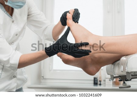 Woman in a modern beauty salon. pedicure procedure
