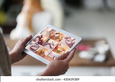 Woman monitoring cameras Live view on the tablets display. Home security system concept - Powered by Shutterstock