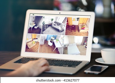 Woman monitoring home security cameras on laptop. Home security system concept