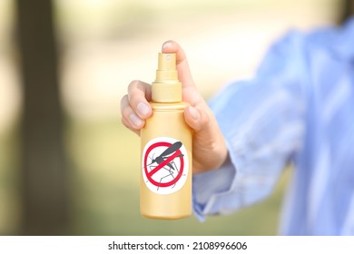 Woman With Mosquito Repellent Spray  Outdoors, Closeup