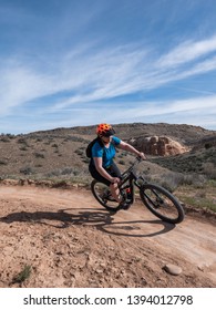 Woman Mountain Biking On Single Track In Fruita, Colorado