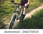 Woman mountain biking on mountain trail