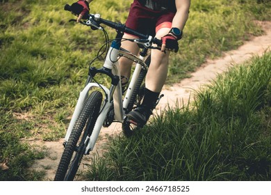 Woman mountain biking on mountain trail - Powered by Shutterstock