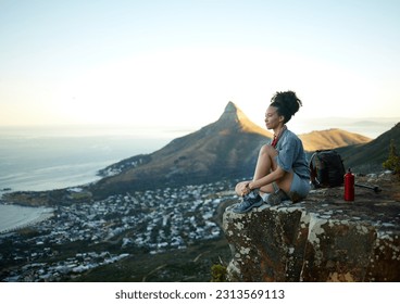 Woman, mountain and sitting with view of cityscape outdoor for exercise in Cape Town. Female hiking, cliff and South Africa for adventure in nature in the morning for wellness on the weekend.