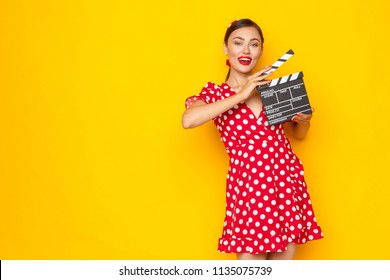 Woman With Movie Clapper Board. Young Retro Pin-up Girl