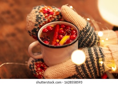 Woman With Mulled Wine At Wooden Table, Closeup