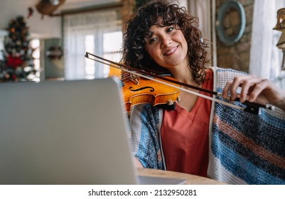 Woman Music Teacher Teaching How To Play A Song The Violin Online During A Video Call