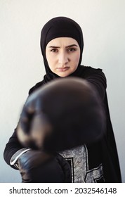 Woman Muslim Boxer Isolated Over White Wall Background.