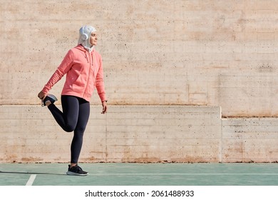 Woman With Muslim Sport Wear Stretching