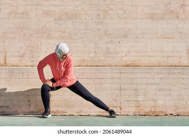 Woman With Muslim Sport Wear Stretching