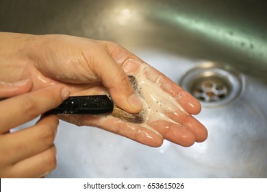 Woman Must Cleaning Makeup Brushes Is Important, Swirl The Brush In Your Palm.