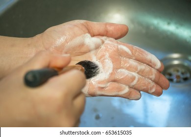 Woman Must Cleaning Makeup Brushes Is Important, Swirl The Brush In Your Palm.