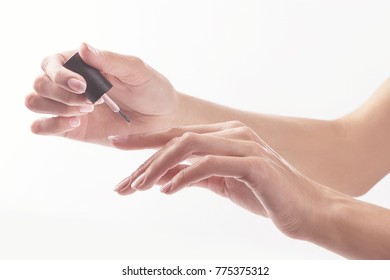 Woman in a nail salon receiving manicure by a beautician. Beauty treatment concept. - Shutterstock ID 775375312