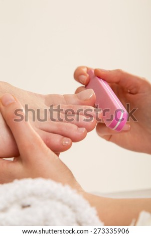 Woman in a nail salon receiving  treatment