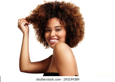 woman with natural makeup, afro hair is laughing