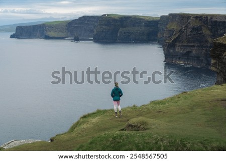 Similar – Ireland, Cliffs of Moher, woman, hiking